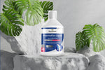 Bottle of Pharmaflex Liquid joint support mix on a stone surface with green leaves in the background